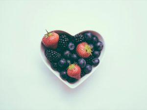 heart shaped bowl containing edible berries